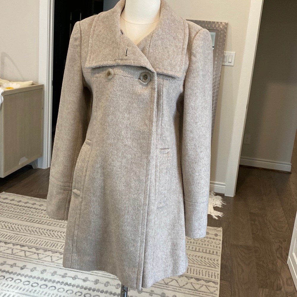 Beige coat with front closures